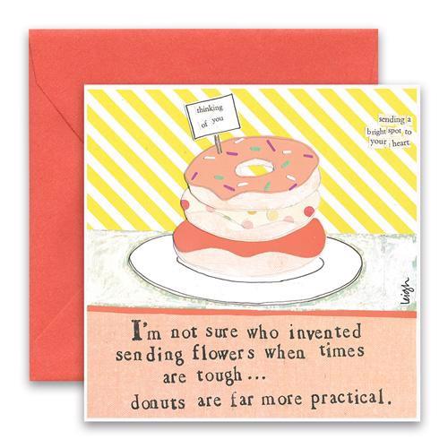 The CURLY GIRL DESIGNS - DONUTS CARD by CURLY GIRL DESIGN, INC features donut collage art with a "thinking of you" flag and a pink envelope. Text: "I'm not sure who invented sending flowers... donuts are far more practical." Blank inside.
