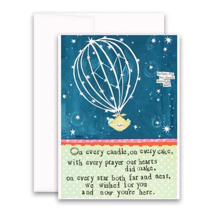 The CURLY GIRL DESIGNS - WISHED FOR YOU CARD from CURLY GIRL DESIGN, INC showcases a starry night hot air balloon with a “baby” basket, glitter accents, and heartfelt poem on blue. Includes a white envelope.
