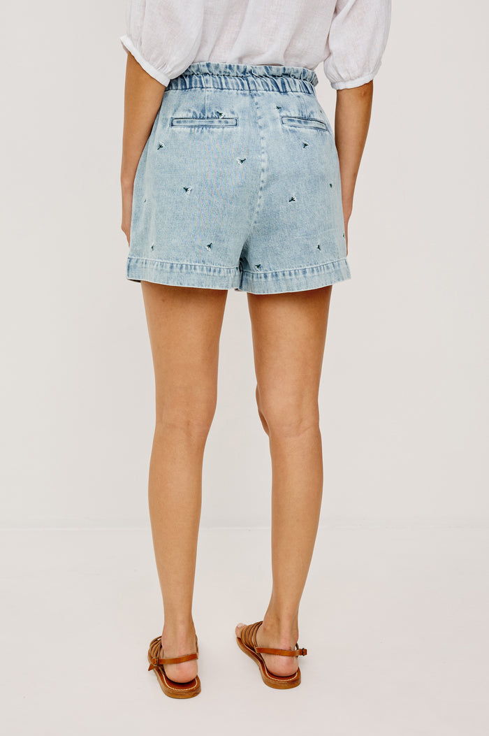 Foster Short in TENCEL™ Denim With High Drawstring Paperbag Waist With Adjustable Ties, Relaxed FIt, and Side and Back Pockets in Ivory Carnations Colorway - Lower Body Back View Featured on Model