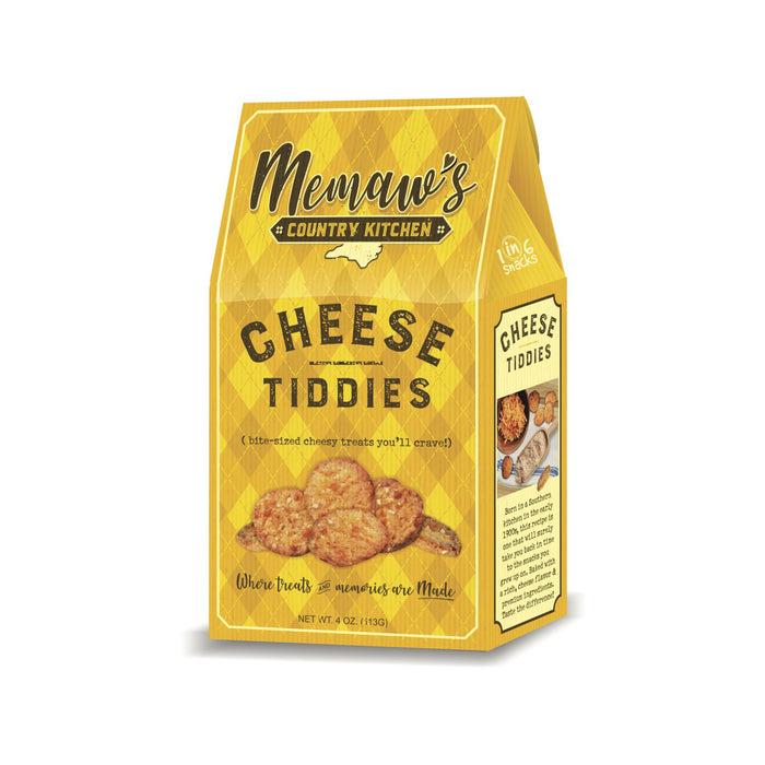 A yellow box labeled “MEMAWS COUNTRY KITCHEN - CHEESE TIDDIES” from 1 IN 6 SNACKS is adorned with images of small, round cheese snacks on the front. The packaging displays a checkered pattern and product details, celebrating a cherished southern recipe that offers irresistibly sweet and cheesy treats crafted with premium ingredients.