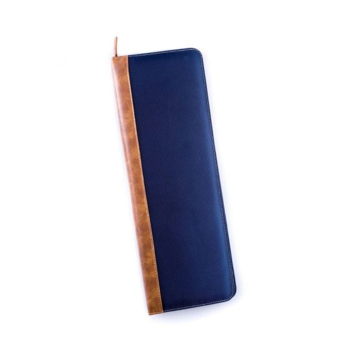 The BEYBERK INTERNATIONAL TRAVEL TIE CASE, crafted from durable ballistic nylon in navy and brown, is open to display organized compartments for a tie, tie bar, and collar stays. The closed case rests neatly beside it.