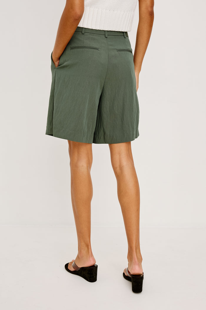 Zamora High-Waist Mid-Length Short With Front Zip Fly Belt Loops and Front Pleats in Ivy Colorway - Lower Body Front View Featured on Model