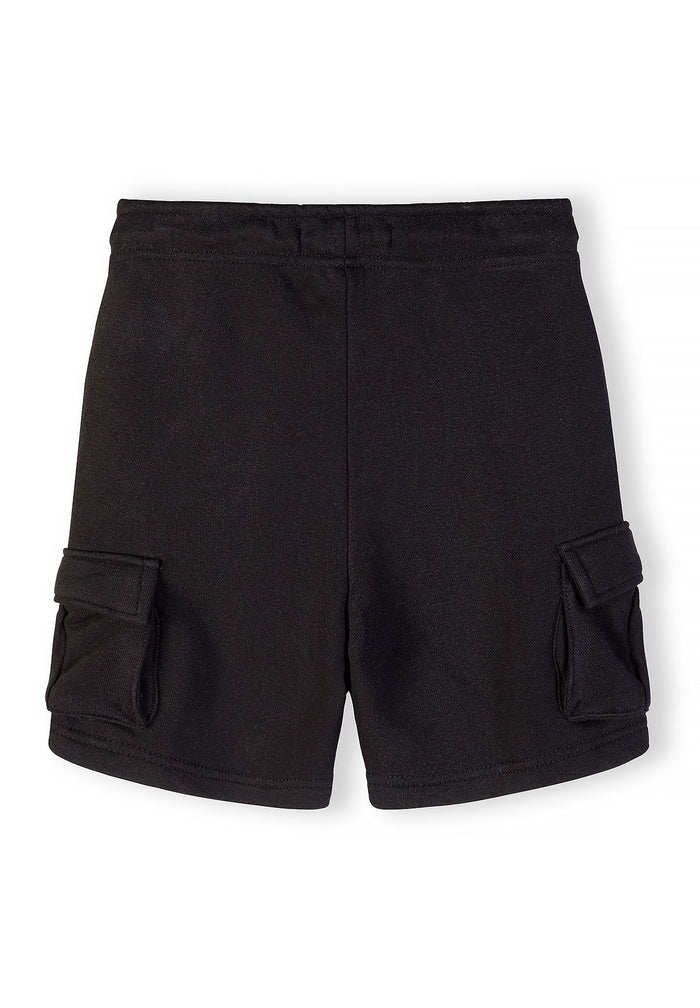 Boys' black cargo shorts, back view with side pockets.
