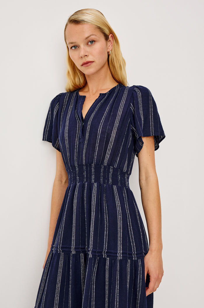 Cannes Midi Dress in Linen With Front Placket Short Sleeves and Smocked Elastic Waist in Marina Stripe Colorway - Upper Body Front View Featured on Model
