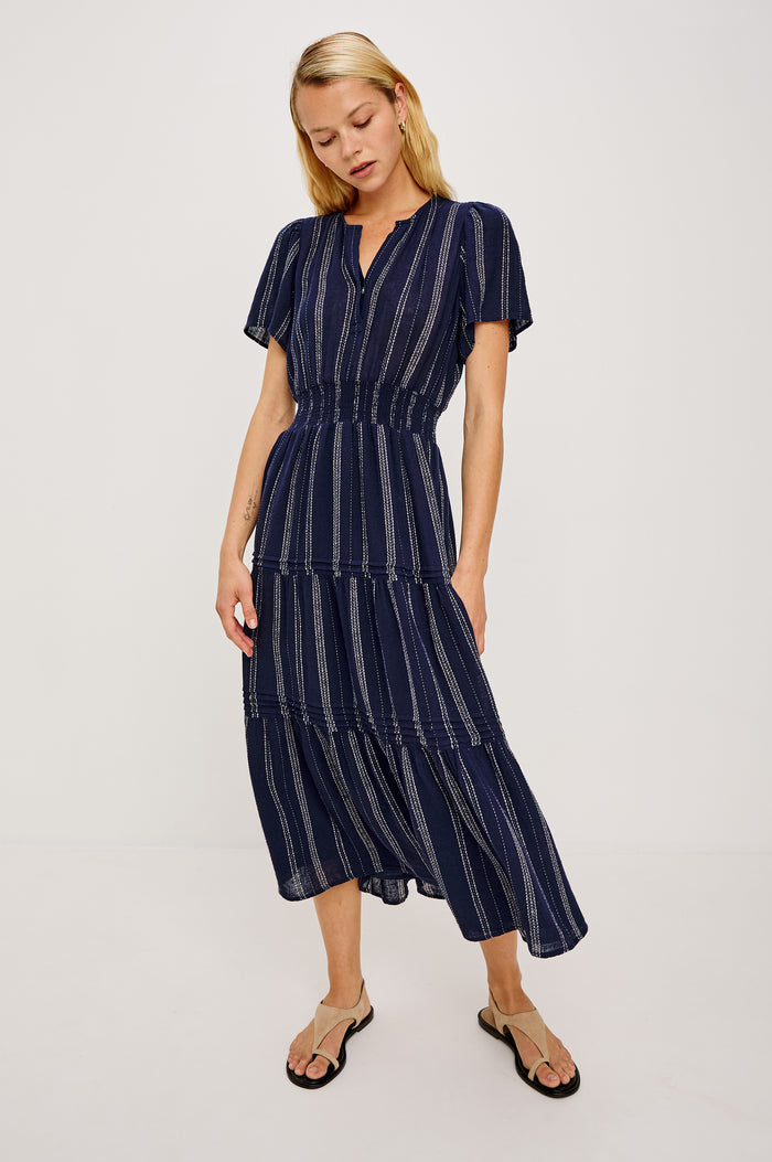 Cannes Midi Dress in Linen With Front Placket Short Sleeves and Smocked Elastic Waist in Marina Stripe Colorway - Full Body Front View Featured on Model