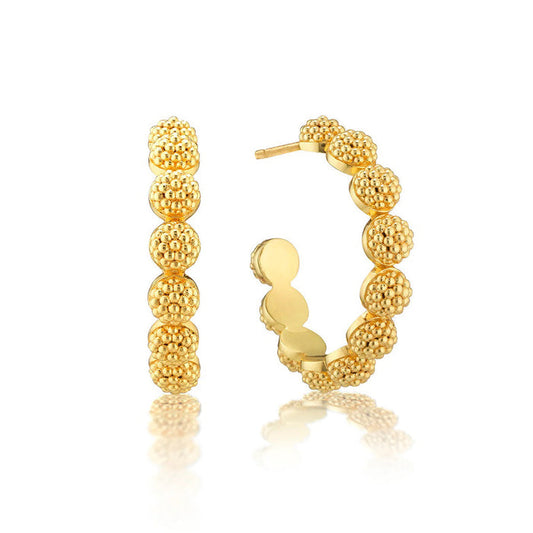 Explore the exquisite charm of CAPUCINE DE WULF's BERRY ICON SMALL HOOP EARRINGS. Their textured, beaded design resembles golden berries, and the front and side views showcase their intricate detailing.