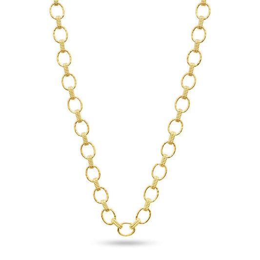 The CAPUCINE DE WULF - CLEOPATRA SMALL LINK NECKLACE features large, hammered gold links with grooved details, forming a bold "V" shape reminiscent of Cleopatra’s iconic style.
