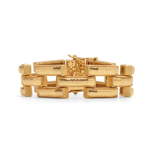 The CAPUCINE DE WULF - PATHWAY LINK BRACELET in gold features hammered, rectangular textured links in a repeating pattern, a secure clasp, and a polished finish—an elegant handmade piece by CAPUCINE DE WULF.