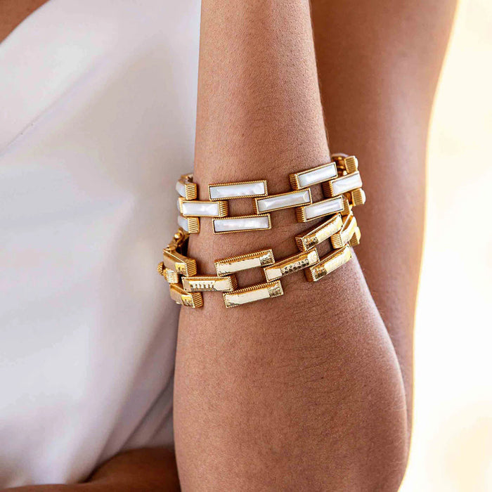 The CAPUCINE DE WULF - PATHWAY LINK BRACELET in gold features hammered, rectangular textured links in a repeating pattern, a secure clasp, and a polished finish—an elegant handmade piece by CAPUCINE DE WULF.