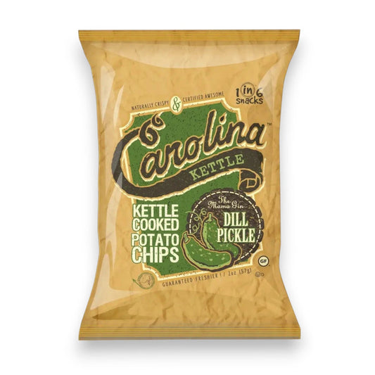 A 5oz bag of CAROLINA KETTLE - DILL PICKLE CHIPS by 1 IN 6 SNACKS comes in tan packaging with green accents and a pickle illustration, emphasizing the bold, tangy flavor of these kettle-cooked potato chips.