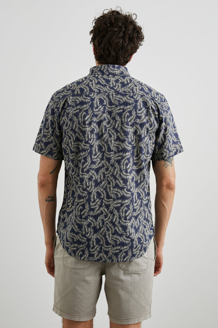 Carson Short Sleeve Button Up with a Chest Patch Pocket in Palm American Navy Colorway, Tan Fronds on Navy - Back View Featured on Model