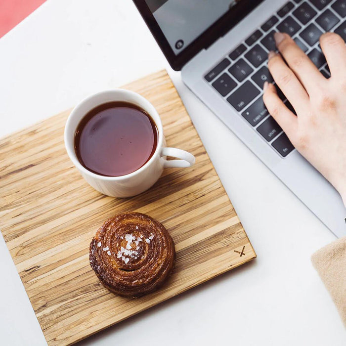 Small cheese board used as snack tray beside laptop – Calgary sustainable homeware