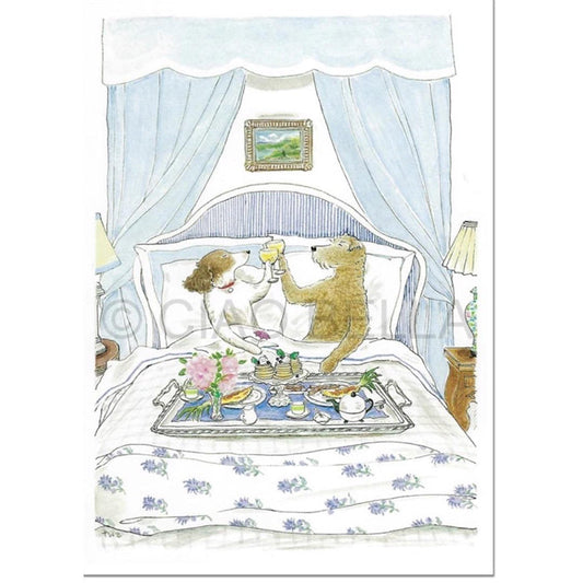 The CIAO BELLA - BREAKFAST IN BED CARD by CIAO BELLA features an upright dog and bear, clinking glasses on a breakfast tray with tea, food, flowers, and a blank card in a cozy room with floral bedding, lamps, and wall art.
