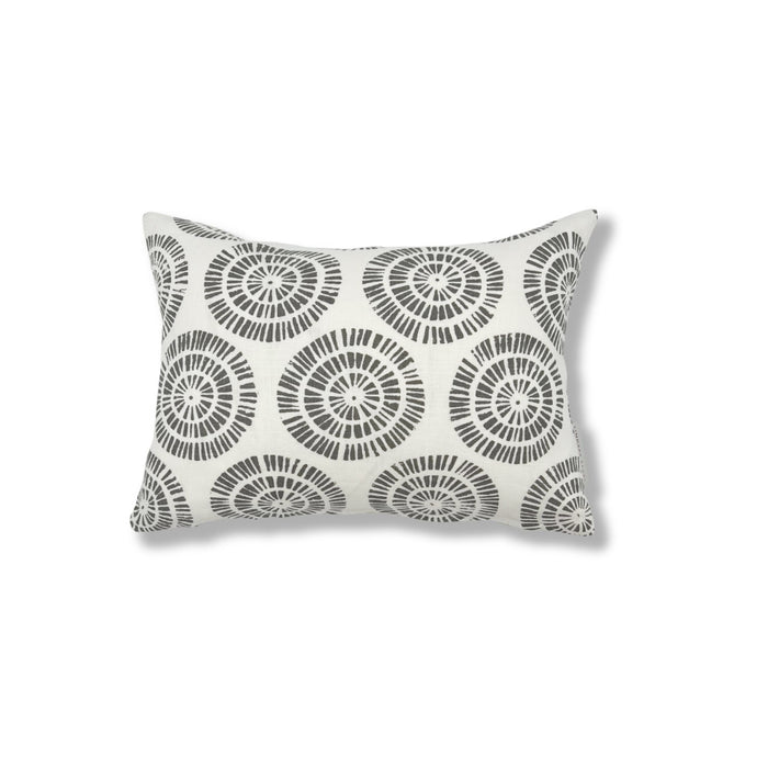 Rectangular throw pillow in a circular dot pattern made of small dashed lines in grey printed on white linen.