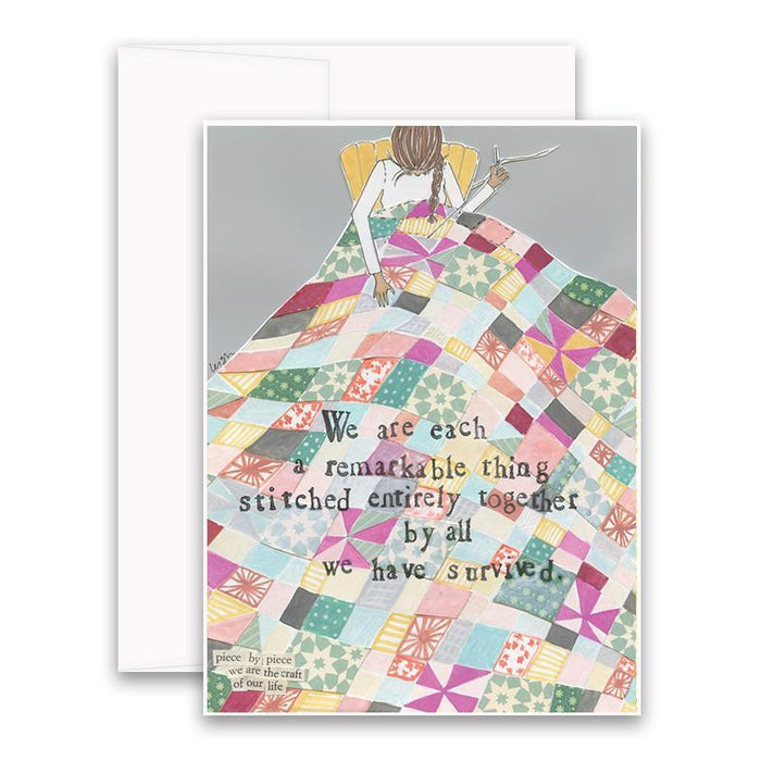 The CURLY GIRL DESIGNS - STITCHED TOGETHER CARD by CURLY GIRL DESIGN, INC features art of a person sewing a vibrant quilt with the message: "We are each a remarkable thing stitched entirely together by all we have survived." Card and envelope included.