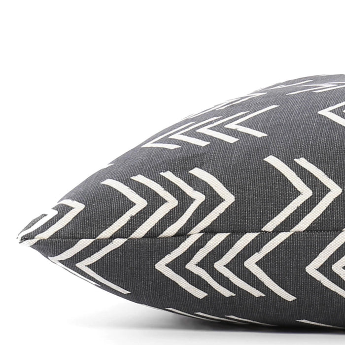 A close-up of THE FOGGY DOG BED (S, MODERN MUD CLOTH BLACK) shows its dark gray fabric with white chevron pattern, pointed corner, and stitched seam against a plain background—a stylish accent for any boho dog bed setup.