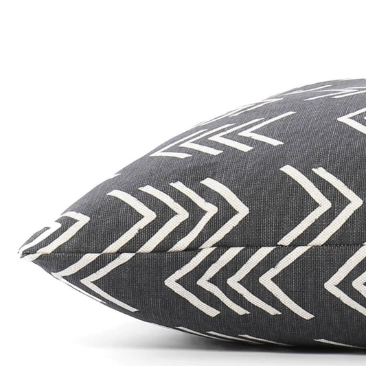 A close-up of THE FOGGY DOG BED (S, MODERN MUD CLOTH BLACK) shows its dark gray fabric with white chevron pattern, pointed corner, and stitched seam against a plain background—a stylish accent for any boho dog bed setup.