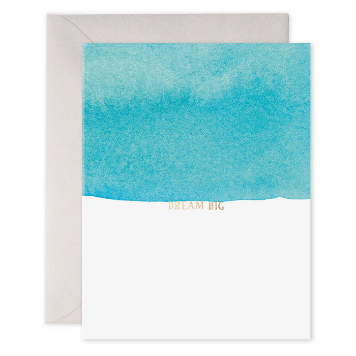 The E. FRANCES PAPER - DREAM BIG CARD showcases a watercolor painting with a blue gradient and "Dream Big" in shimmering gold. It exudes positive energy, printed on luxe heavyweight paper, and paired with a matching white envelope by E. FRANCES PAPER.