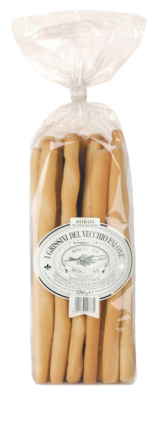 A clear plastic bag sealed at the top contains GRISSINI DEL VECCHIO PALONE - BREADSTICKS by INTERNATIONAL GOURMET FOODS, long rustic breadsticks with a round white label—perfect for charcuterie and inspired by northern Italy.