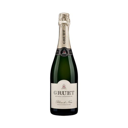 A bottle of Gruet Blanc de Noirs sparkling wine from New Mexico, crafted using the Champagne method, has a green glass body, beige foil on the neck, and a white label with black text for Wine: Empire Distributing.