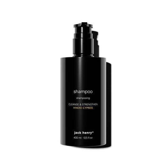 A sleek black pump bottle labeled "JACK HENRY - CREAMY SHAMPOO" with JACK HENRY branding holds 400 ml of keratin-infused formula, displayed against a white background.