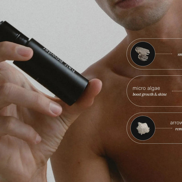 A shirtless person holds a black JACK HENRY – HAIR POWDER bottle, a dry shampoo with smectite, micro algae for growth and shine, and arrowroot to absorb oil—leaving hair clean and matte.
