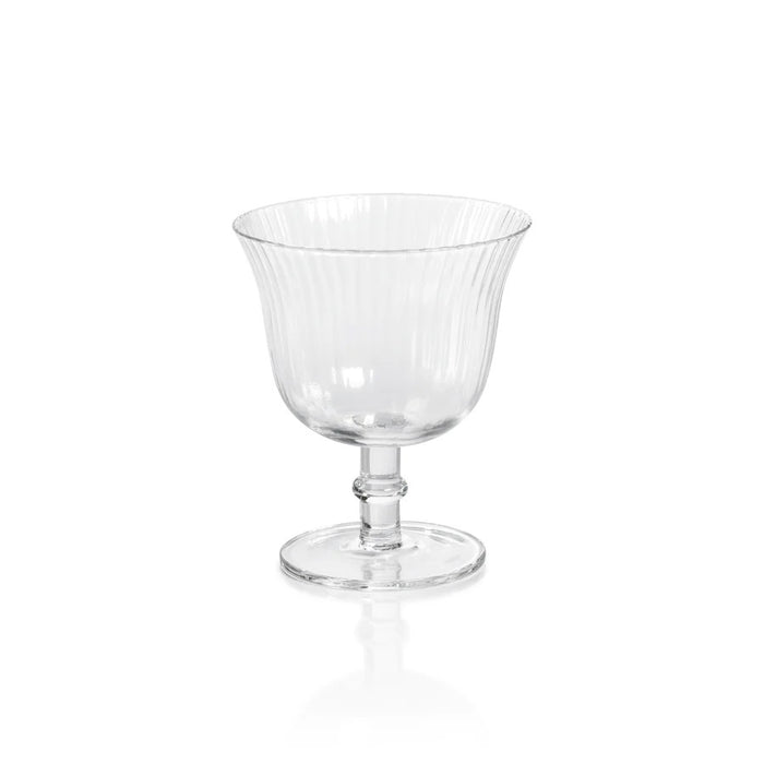 The ZODAX JULIEN OPTIC COCKTAIL GLASS features a clear fluted bowl, short stem, and circular base, shown against a white background—ideal as an elegant small drinking glass for special occasions.