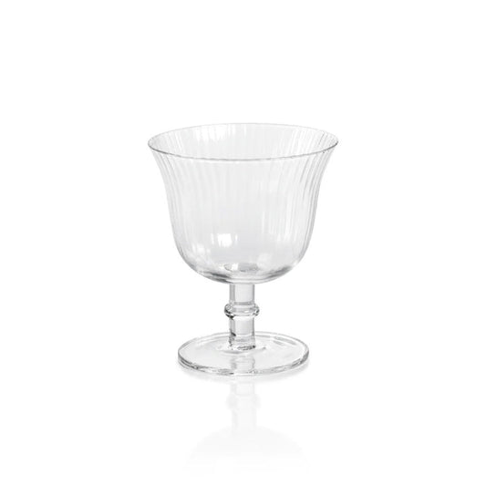 The ZODAX JULIEN OPTIC COCKTAIL GLASS features a clear fluted bowl, short stem, and circular base, shown against a white background—ideal as an elegant small drinking glass for special occasions.