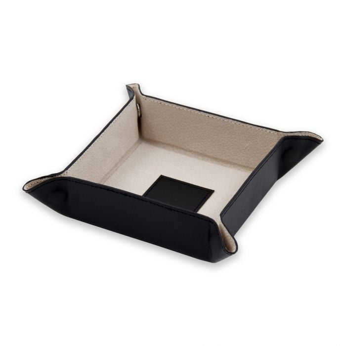 The BEYBERK INTERNATIONAL LEATHER VALET IN BLACK features raised edges and a light interior, perfect for organizing keys or coins. Snap-together corners complete the design, with a small black square accent inside.