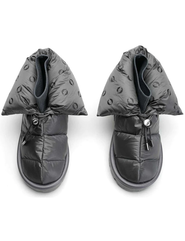 The FLUFIE METALLIC PILLOW BOOT is a pair of gray, insulated slippers with drawstring closures, a high folded collar, water repellent fabric in a subtle circular pattern, designed for warmth and shown on a white background.