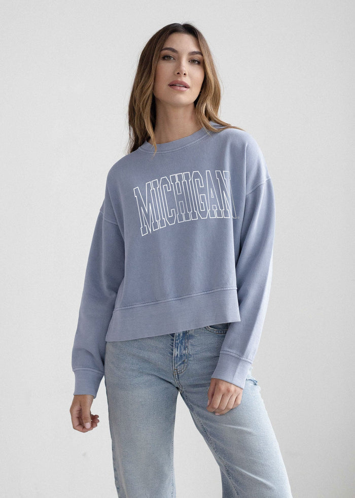 Michigan Wolverines Women's Ocean Relaxed, waist-length, boxy Salt wash fleece Sweatshirt with Crew neck, worn out look, long sleeves and ribbed neckline, cuffs and hem