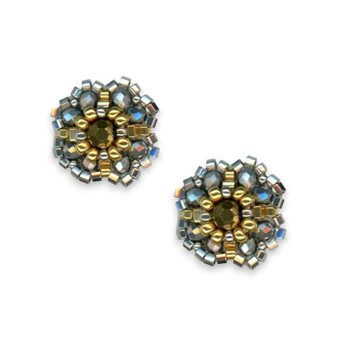 The MIGUEL ASES - BEADED MIYUKI STUD EARRINGS by MIGUEL ASES, INC. are round, American-handcrafted earrings with gold and silver beads in a floral pattern, a faceted gold center, metallic accents, and 14K gold-filled finishes.