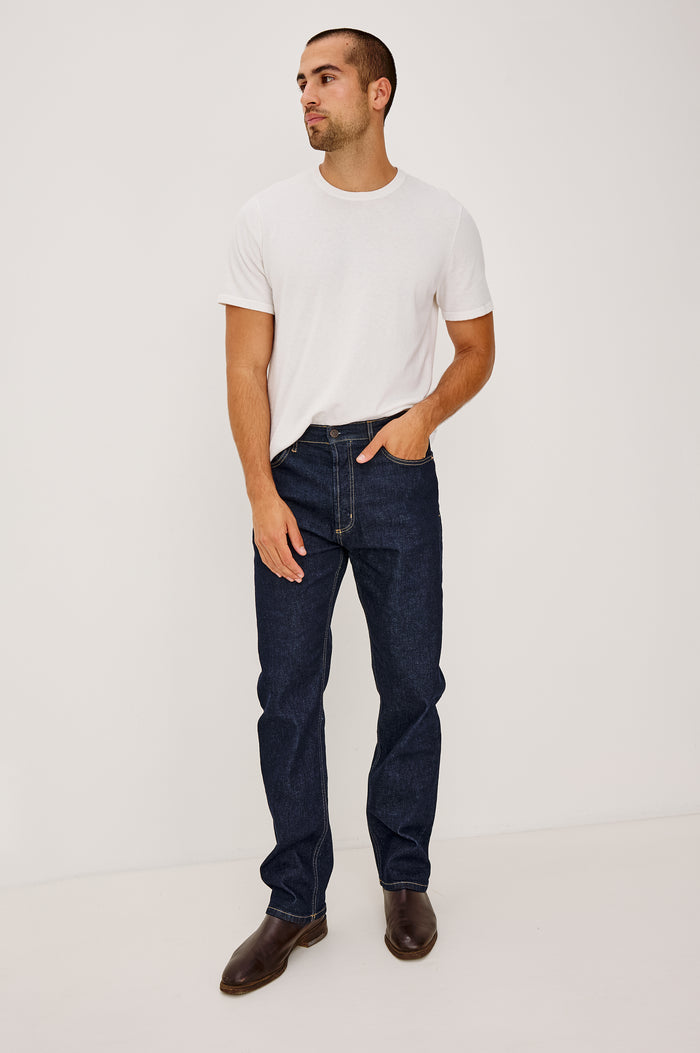 Nash Straight Leg Jean in Comfort Strech Denim With 5-Pockets and Front Zip Fly in Rinse Wash Colorway - Full Body Front View Featured on Model