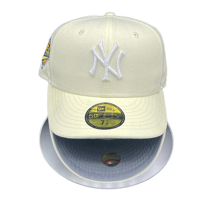 A New York Yankees baseball cap with a chrome white crown and grey UV visor, featuring the team's logo and a 1996 World Series patch.