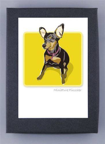 This depiction of a Miniature Pinscher on a yellow backdrop highlights its large ears, black and tan coat, and collar. Presented in a sleek black frame, the phrase "Miniature Pinscher" appears below. It's printed on premium recycled paper made in the USA by PAPER RUSSELLS - MINIATURE PINSCHER BOX NOTES.