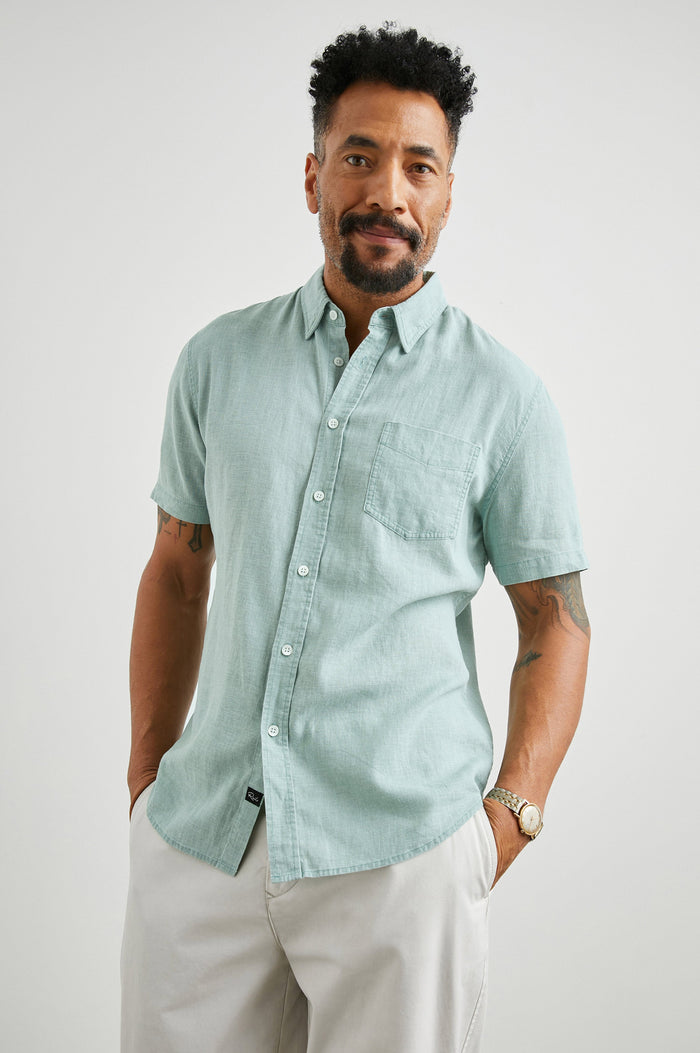 Paros Short-Sleeve Button Up with a Chest Patch Pocket in Jade Colorway - Front View Featured on Model