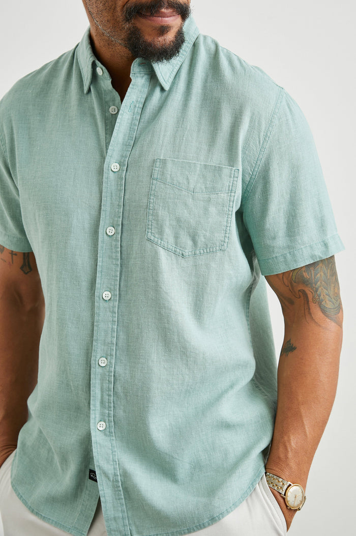 Paros Short-Sleeve Button Up with a Chest Patch Pocket in Jade Colorway - Front View Featured on Model