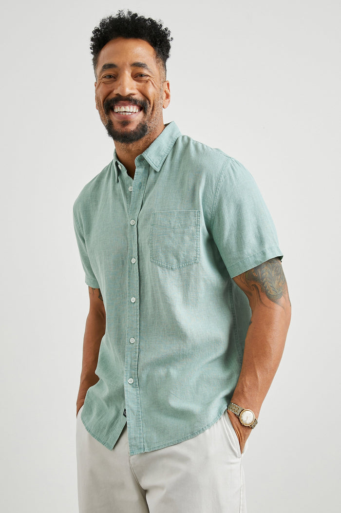 Paros Short-Sleeve Button Up with a Chest Patch Pocket in Jade Colorway - Front View Featured on Model