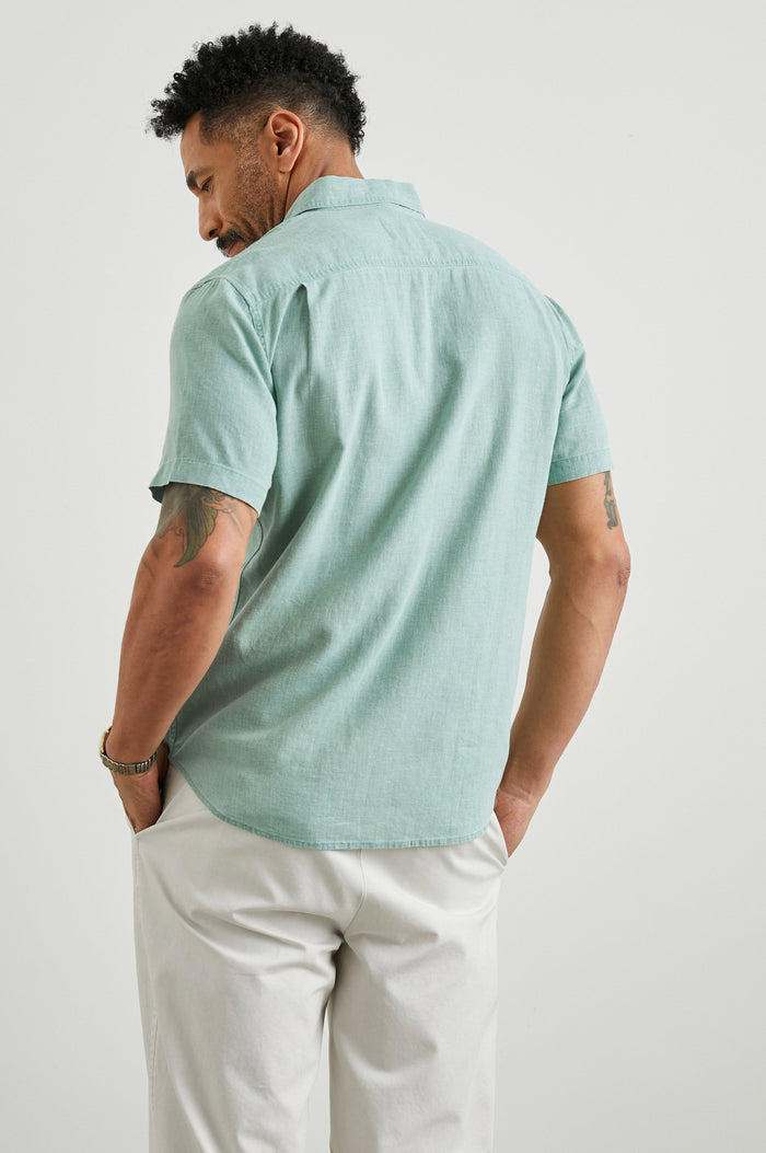 Paros Short-Sleeve Button Up with a Chest Patch Pocket in Jade Colorway - Back View Featured on Model