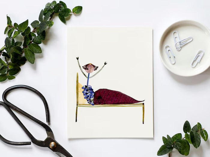 The PETAL PEOPLE PRESS - GET WELL SOON CARD by PETAL PEOPLE PRESS showcases a whimsical figure made from leaves and flowers on a simple-lined bed. The earthy-toned person, resembling a closed flower bud with raised arms, makes it perfect for a botanical-themed card.