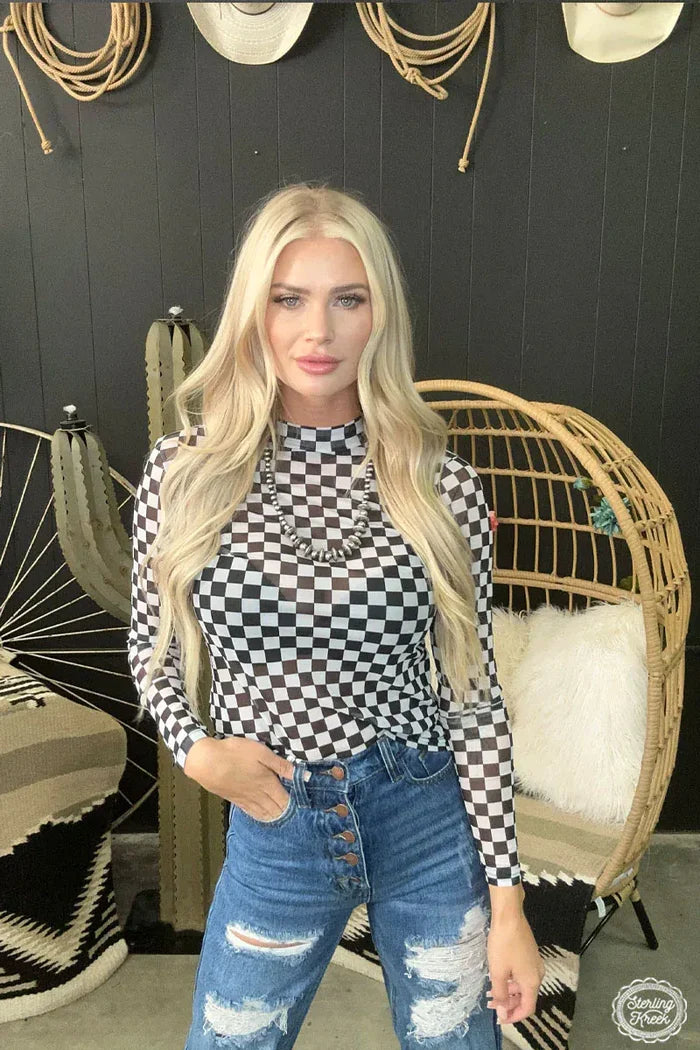 Woman in checkered top and jeans