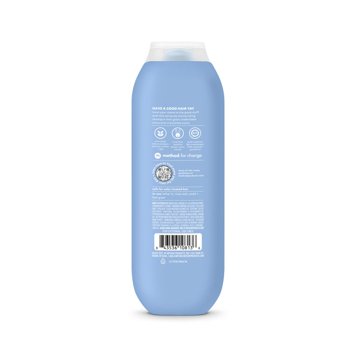 The blue method shampoo bottle with a white cap prominently displays its back label featuring text, logos, and a barcode. This volumizing product is made with cruelty-free ingredients for guilt-free beauty.