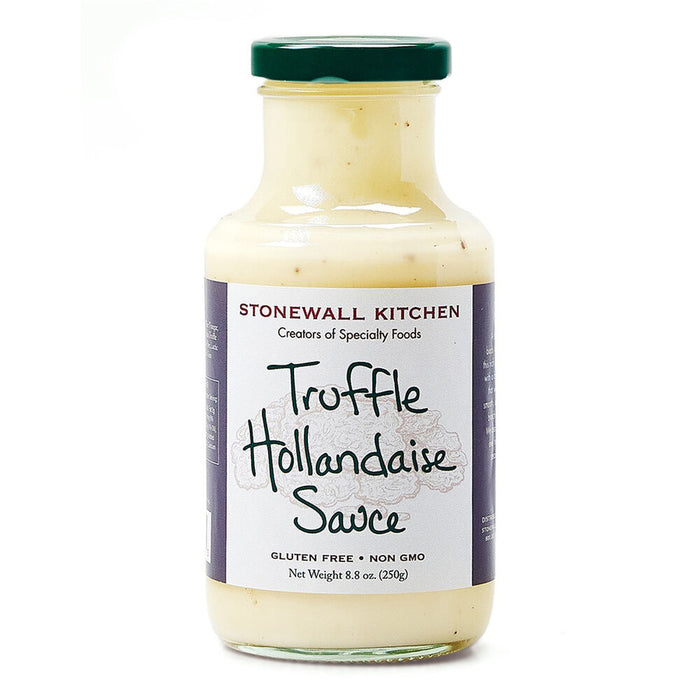 Indulge in a luxurious eggs Benedict with STONEWALL KITCHEN- TRUFFLE HOLLANDAISE Sauce. This gluten-free and non-GMO product boasts a net weight of 8.8 oz (250g). The jar is adorned with a green lid against a white background, exuding the rich aroma of black truffles.
