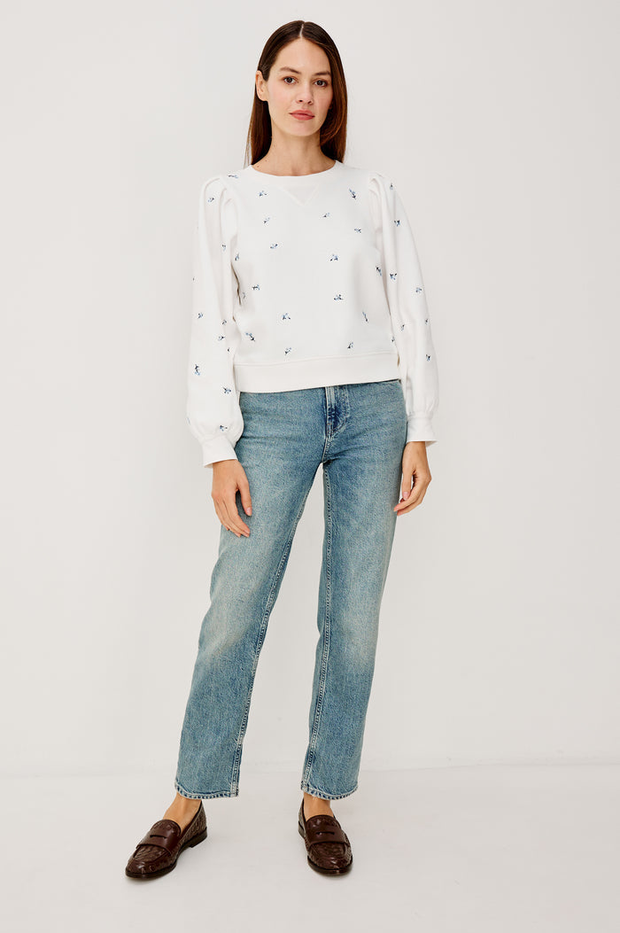 Tiffany Crewneck Sweatshirt in French Terry With Contrast Floral Embroidery, Long Puff Sleeves With Fitted Cuffs, and Ribbed Trim in Blue Iris Colorway - Full Body Front View Featured on Model