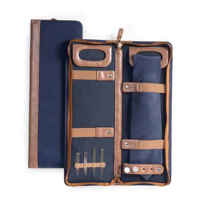 The BEYBERK INTERNATIONAL TRAVEL TIE CASE, crafted from durable ballistic nylon in navy and brown, is open to display organized compartments for a tie, tie bar, and collar stays. The closed case rests neatly beside it.