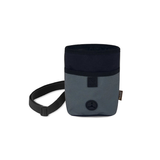 The TREAT POUCH ECLIPSE by PLAY PET LIFESTYLES/BRANDS is a small, two-tone blue and gray fabric pouch featuring a black strap and a circular black poop bag dispenser at the bottom front—an ideal Deluxe treat pouch for walks or dog training sessions.