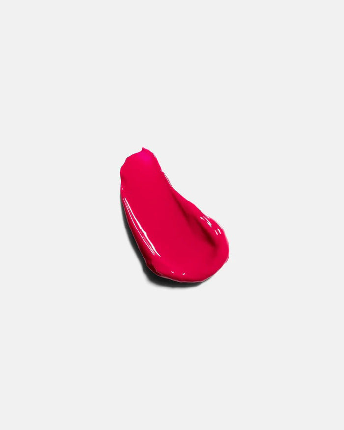 A 15ml tube of U BEAUTY THE PLASMA LIP COMPOUND, a plumping lip treatment with light gray packaging and white branding, stands upright against a white background.