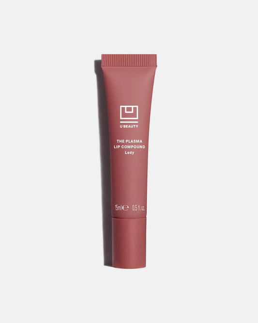 A light gray tube of U BEAUTY THE PLASMA LIP COMPOUND 15ML stands upright with white text and logo, highlighting this hydrating lip treatment and plumper against a white background.