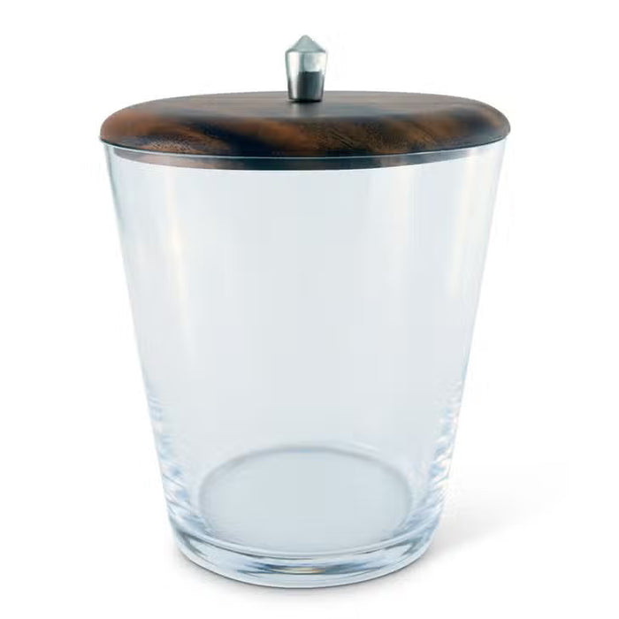 The VAGABOND HOUSE - TRIBECA GLASS ICE BUCKET features clear glass, a brown wooden lid with a small metallic knob, and is inspired by Mid-Century Modern style, shown against a white background.