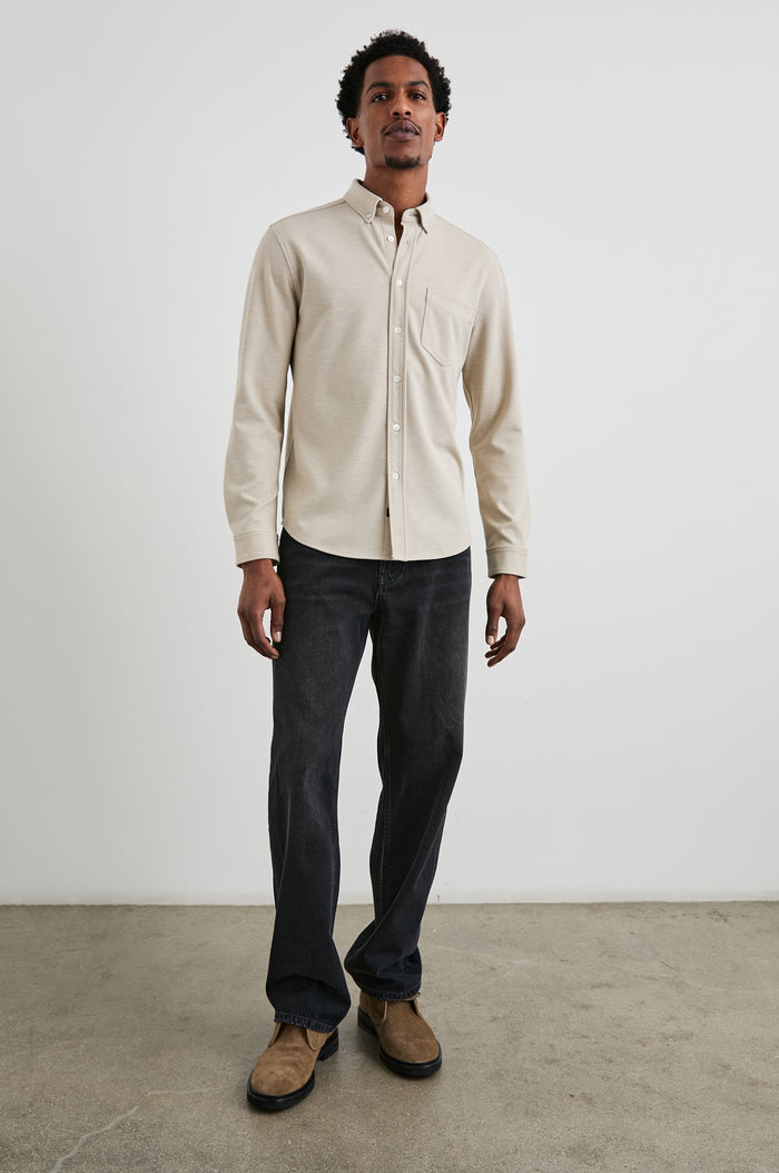 Vincent long sleeve shirt combines comfort of a knit with a buttoned classic collar. Front view of model feautured.